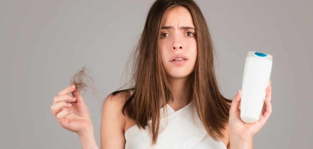 hair-loss-woman-with-bootle-shampoo-is-upset-hair-loss-portrait-sad-girl-with-problem-hair-isolated-worried-girl-holding-long-damaged-unhealthy-hair-hand2