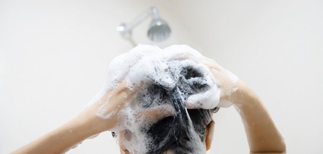lady-using-shampoo-wash-clean-her-hair-bathroom-with-splash-shower-spray-water (1)