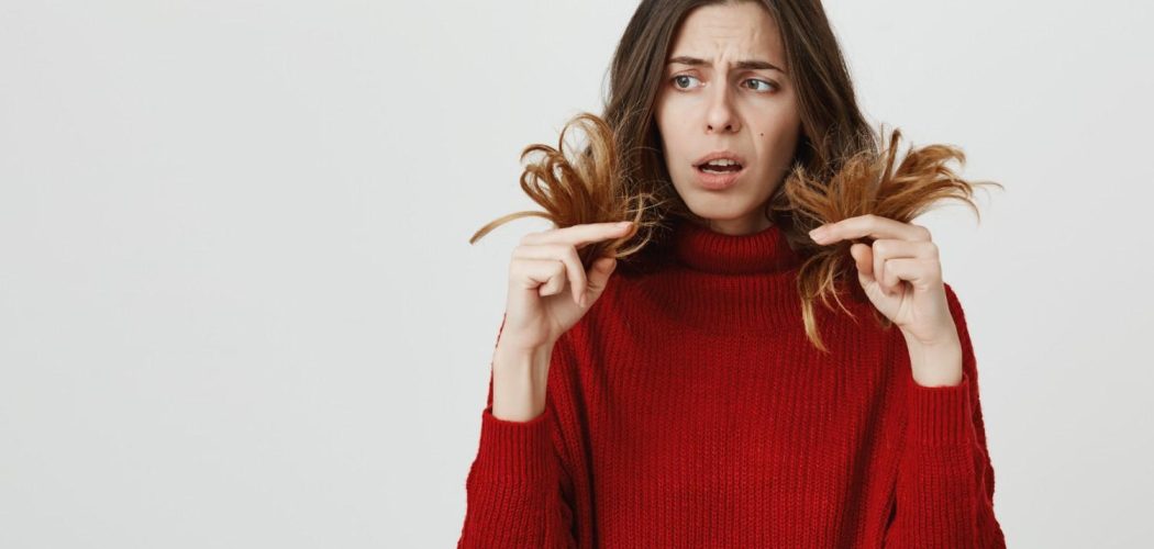shocked-woman-looking-split-ends-need-hairdresser (1)