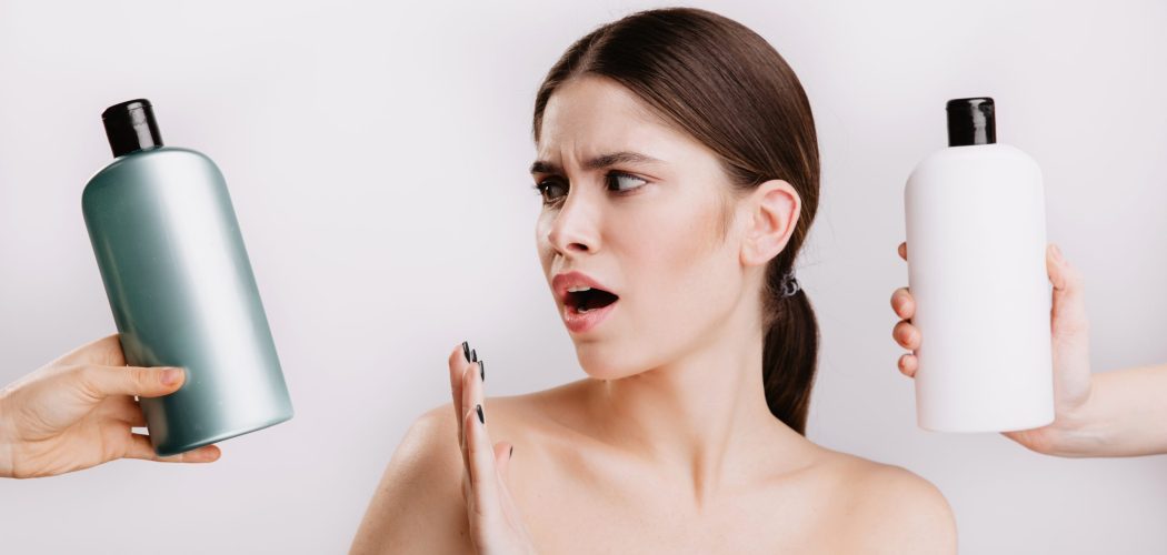 Snapshot of beautiful lady on white background. Girl refuses to use shampoo with chemicals in favor of natural