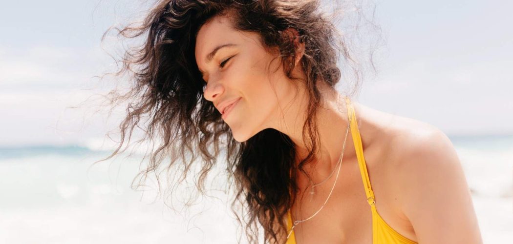 stylish-happy-woman-wearing-yellow-swimsuit-posing-island (1)