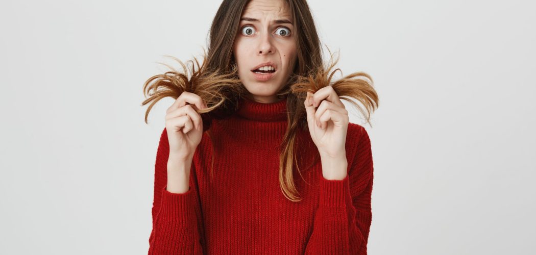 Clueless puzzled girl with opened mouth, having hesitation, being stunned and confused, expressing uncertainty. Facial expressions, life perception and attitude concept. Woman looks at camera in bewilderment