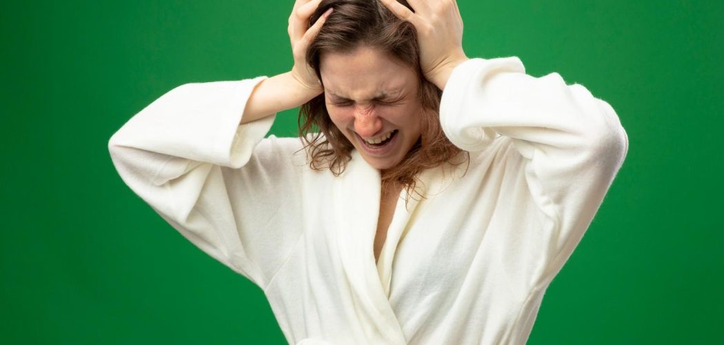 with-lowered-head-aching-young-ill-girl-wearing-white-robe-grabbed-head (2)